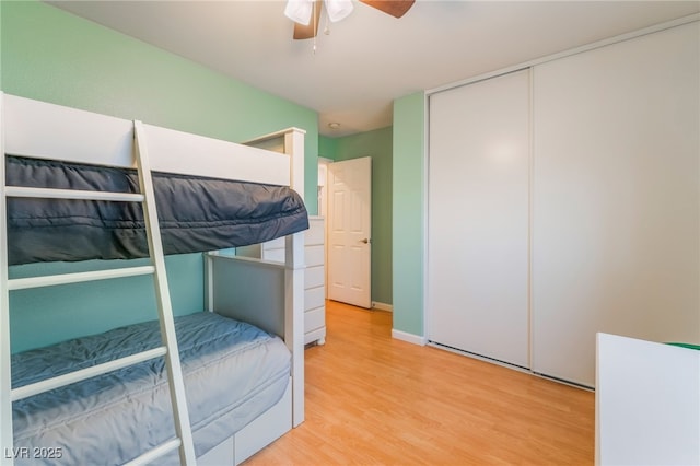 2064 Spiers Ave, Las Vegas, NV 89183 - bedroom with light wood finished floors, a closet, and ceiling fan