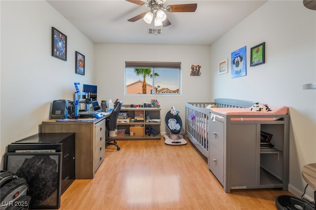 2064 Spiers Ave, Las Vegas, NV 89183 - home office with light wood-style floors and ceiling fan