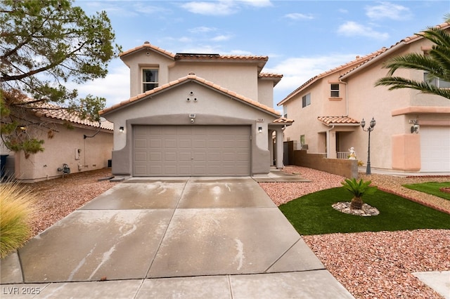 2064 Spiers Ave, Las Vegas, NV 89183 - mediterranean / spanish house with concrete driveway, a tile roof, stucco siding, and an attached garage
