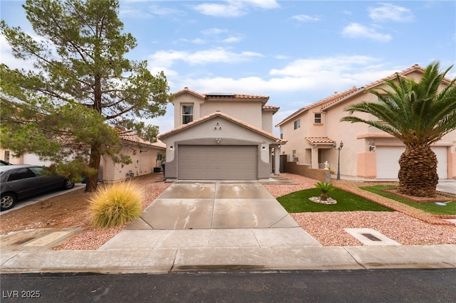 2064 Spiers Ave, Las Vegas, NV 89183 - mediterranean / spanish-style house with stucco siding, a tiled roof, solar panels, concrete driveway, and a garage