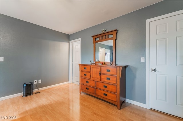2064 Spiers Ave, Las Vegas, NV 89183 - bedroom featuring light wood-type flooring and baseboards