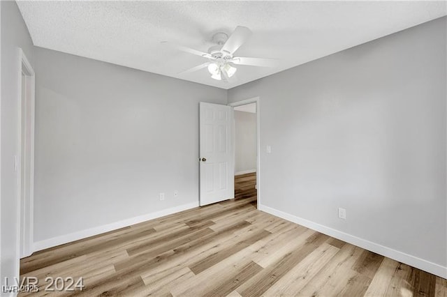 5576 W Rochelle Ave Unit 9C, Las Vegas, NV 89103 - spare room featuring light wood-style floors and a ceiling fan