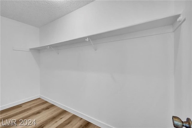 5576 W Rochelle Ave Unit 9C, Las Vegas, NV 89103 - walk in closet with light wood finished floors