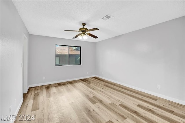 5576 W Rochelle Ave Unit 9C, Las Vegas, NV 89103 - spare room featuring light wood-style floors, ceiling fan, and a textured ceiling