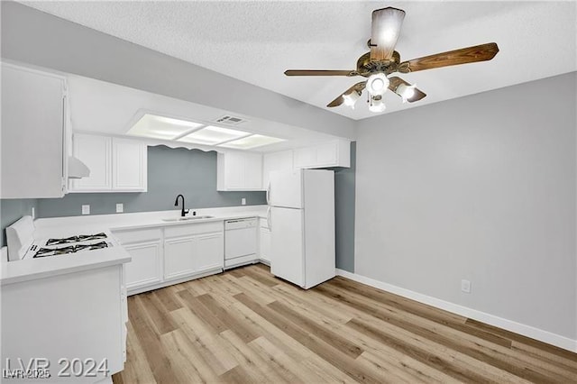 5576 W Rochelle Ave Unit 9C, Las Vegas, NV 89103 - kitchen featuring white appliances, light wood-style flooring, light countertops, and white cabinetry