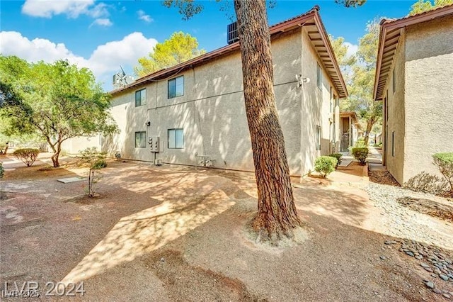 5576 W Rochelle Ave Unit 9C, Las Vegas, NV 89103 - back of property with stucco siding and a patio