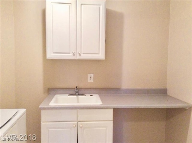 1710 N Murphy St, Pahrump, NV 89060 - laundry room featuring cabinet space