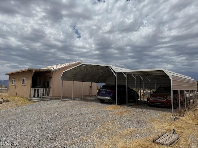 1710 N Murphy St, Pahrump, NV 89060 - view of parking / parking lot with a carport and gravel driveway