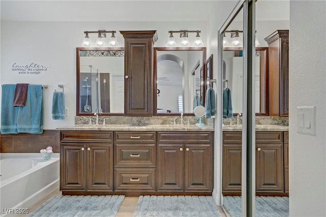 7013 Bisoni St, Las Vegas, NV 89149 - full bath featuring double vanity, a garden tub, and an enclosed shower