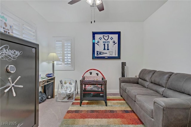 7013 Bisoni St, Las Vegas, NV 89149 - carpeted living area featuring ceiling fan and baseboards