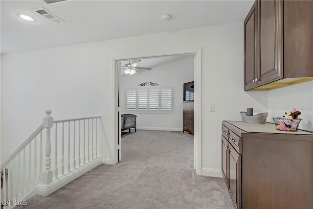 7013 Bisoni St, Las Vegas, NV 89149 - hallway featuring light colored carpet and an upstairs landing