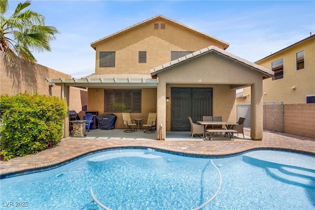 7013 Bisoni St, Las Vegas, NV 89149 - back of property with stucco siding, a patio, and outdoor dining area