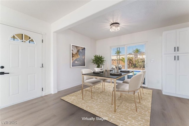 2 Utah Way, Henderson, NV 89015 - dining area with light wood-style flooring and baseboards