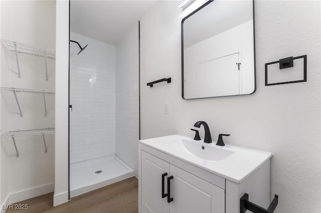 2 Utah Way, Henderson, NV 89015 - full bath with wood finished floors, vanity, a stall shower, and a walk in closet