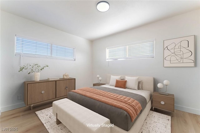 2 Utah Way, Henderson, NV 89015 - bedroom with multiple windows and light wood-type flooring