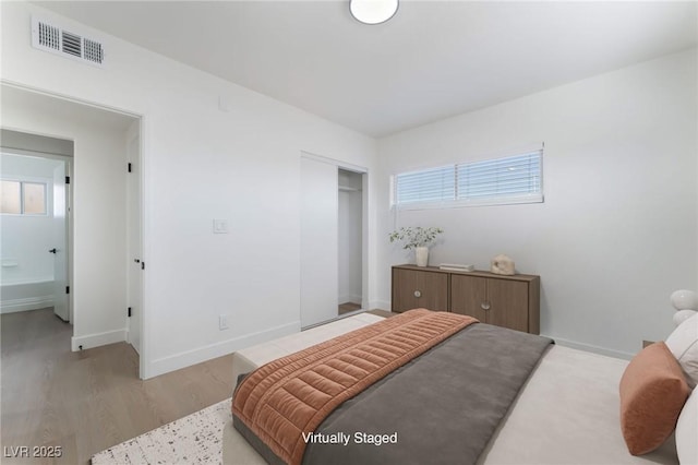 2 Utah Way, Henderson, NV 89015 - bedroom with a closet and light wood-type flooring