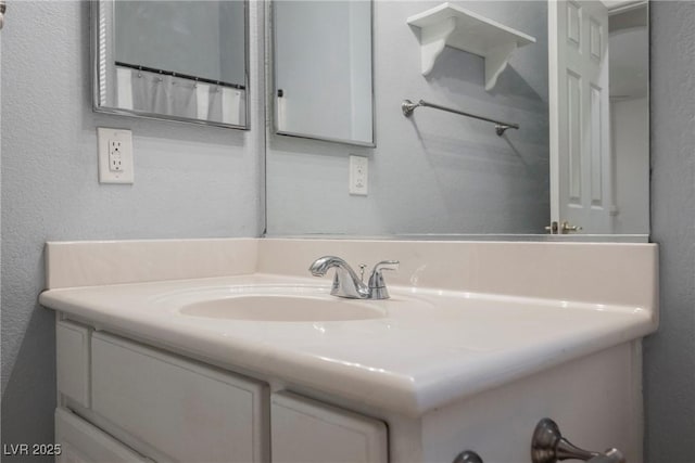 1598 Cowboy Chaps Pl, Henderson, NV 89002 - full bathroom featuring vanity and a textured wall