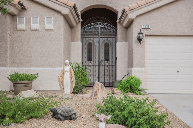 1598 Cowboy Chaps Pl, Henderson, NV 89002 - view of exterior entry featuring stucco siding and a garage