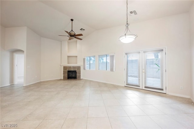 1598 Cowboy Chaps Pl, Henderson, NV 89002 - unfurnished living room with healthy amount of natural light, high vaulted ceiling, arched walkways, ceiling fan, and light tile patterned flooring