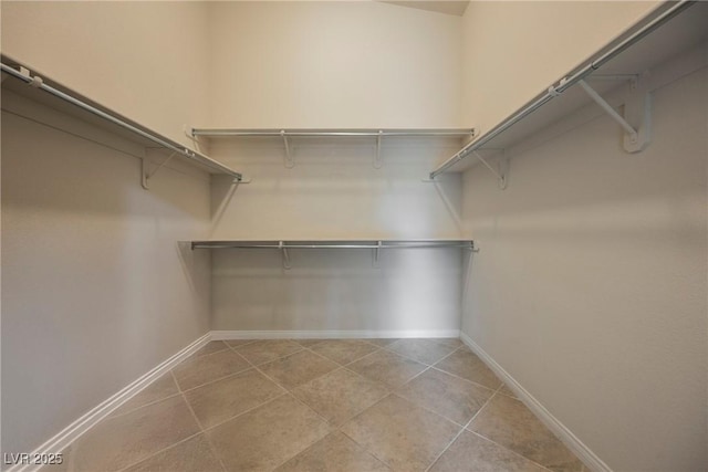 1598 Cowboy Chaps Pl, Henderson, NV 89002 - walk in closet featuring light tile patterned floors