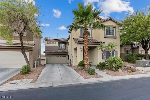 8325 Winterchase Pl, Las Vegas, NV 89143 - mediterranean / spanish-style home with stucco siding, a tiled roof, solar panels, driveway, and an attached garage