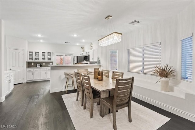 8325 Winterchase Pl, Las Vegas, NV 89143 - dining space featuring dark wood finished floors, a chandelier, and recessed lighting