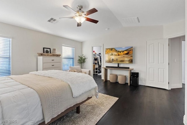 8325 Winterchase Pl, Las Vegas, NV 89143 - bedroom featuring lofted ceiling, a spacious closet, dark wood finished floors, a closet, and a ceiling fan
