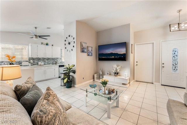 2093 Seahurst Dr, Las Vegas, NV 89142 - living room featuring light tile patterned floors, lofted ceiling, and a ceiling fan
