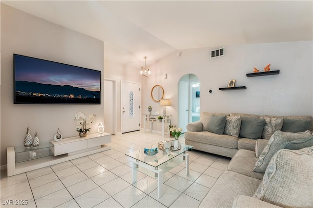 2093 Seahurst Dr, Las Vegas, NV 89142 - living area featuring arched walkways, light tile patterned flooring, lofted ceiling, and a chandelier