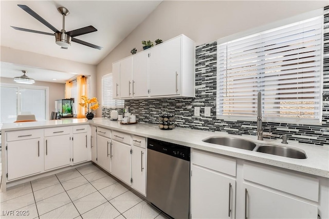 2093 Seahurst Dr, Las Vegas, NV 89142 - kitchen featuring stainless steel dishwasher, ceiling fan, lofted ceiling, light countertops, and decorative backsplash