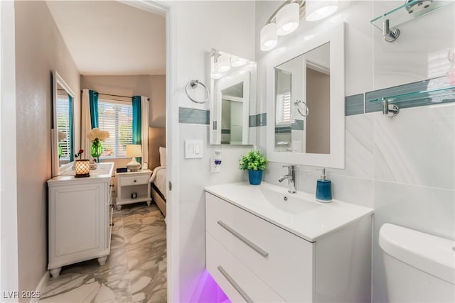 2093 Seahurst Dr, Las Vegas, NV 89142 - bathroom featuring marble finish flooring, vanity, and ensuite bath