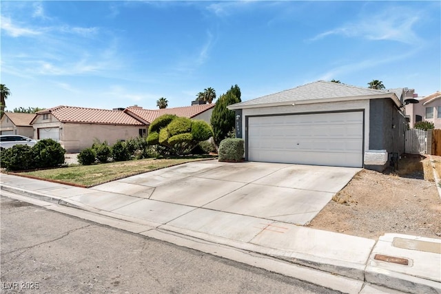 2093 Seahurst Dr, Las Vegas, NV 89142 - ranch-style house featuring a garage, stucco siding, and concrete driveway