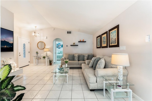 2093 Seahurst Dr, Las Vegas, NV 89142 - living area featuring arched walkways, a chandelier, vaulted ceiling, and light tile patterned floors