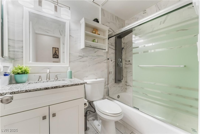 2093 Seahurst Dr, Las Vegas, NV 89142 - full bathroom featuring vanity, bath / shower combo with glass door, and tile walls