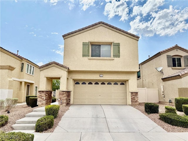 5517 Overlook Valley St, North Las Vegas, NV 89081 - view of front of house with a garage, stucco siding, concrete driveway, and stone siding