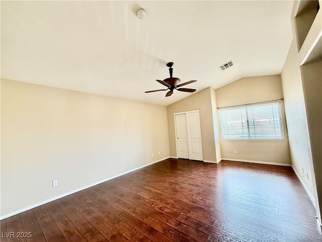 5517 Overlook Valley St, North Las Vegas, NV 89081 - unfurnished room featuring vaulted ceiling, dark wood-style flooring, ceiling fan, and a smoke detector