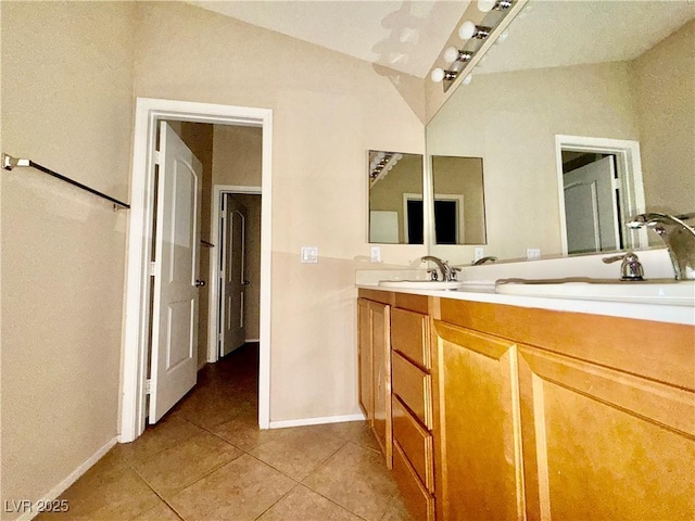 5517 Overlook Valley St, North Las Vegas, NV 89081 - full bath with tile patterned floors, double vanity, and lofted ceiling