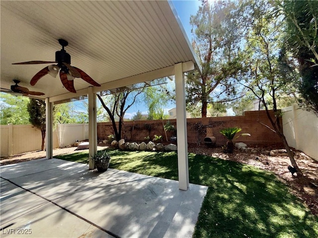 5517 Overlook Valley St, North Las Vegas, NV 89081 - fenced backyard with a ceiling fan and a patio area