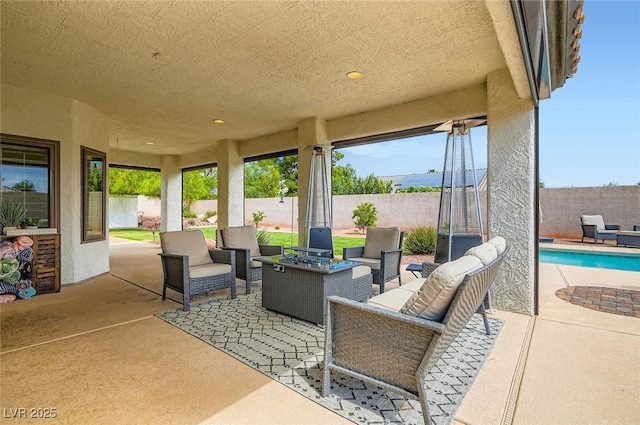7404 Wittig Ave, Las Vegas, NV 89131 - fenced backyard featuring an outdoor hangout area and a patio