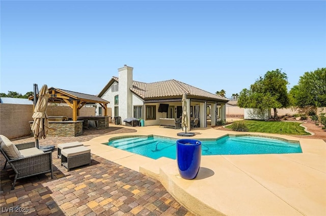 7404 Wittig Ave, Las Vegas, NV 89131 - view of pool with an outdoor living space, a patio, a gazebo, and a fenced backyard