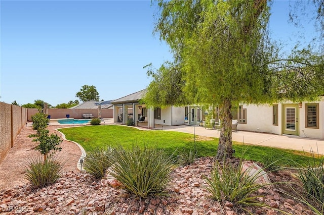 7404 Wittig Ave, Las Vegas, NV 89131 - fenced backyard featuring french doors and a patio