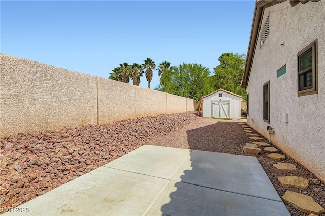 7404 Wittig Ave, Las Vegas, NV 89131 - fenced backyard featuring a storage unit and a patio