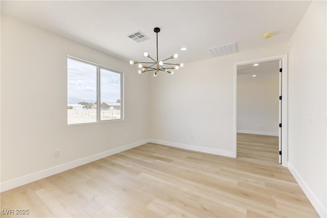 2461 S Blagg Rd, Pahrump, NV 89048 - unfurnished room featuring light wood finished floors, a chandelier, a smoke detector, and recessed lighting