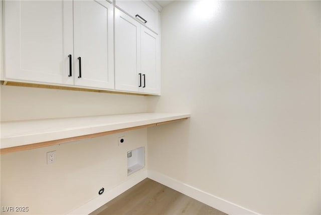 2461 S Blagg Rd, Pahrump, NV 89048 - washroom with cabinet space, light wood-style flooring, and hookup for an electric dryer