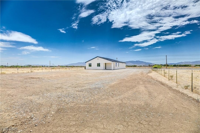 2461 S Blagg Rd, Pahrump, NV 89048 - view of front of property featuring a mountain view and a view of rural / pastoral area