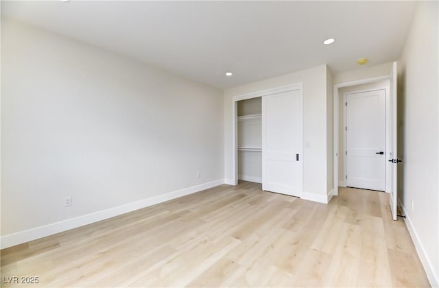2461 S Blagg Rd, Pahrump, NV 89048 - unfurnished bedroom featuring light wood-style flooring, recessed lighting, and a closet