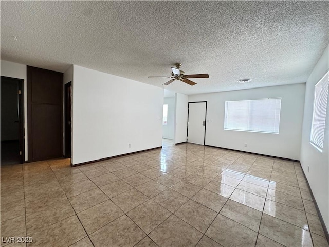4303 Paramount St, Las Vegas, NV 89115 - spare room featuring light tile patterned floors, ceiling fan, and a textured ceiling
