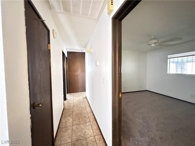 4303 Paramount St, Las Vegas, NV 89115 - hall featuring light tile patterned floors and baseboards