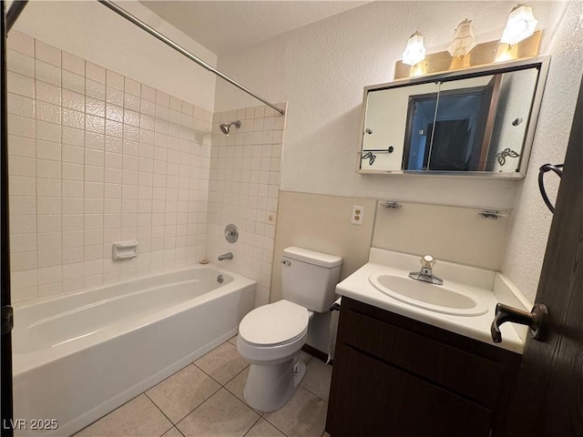 4303 Paramount St, Las Vegas, NV 89115 - bathroom featuring a textured wall, shower / bath combination, tile patterned flooring, and vanity