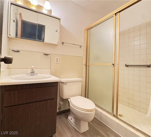 4303 Paramount St, Las Vegas, NV 89115 - bathroom with wood finished floors, a shower stall, and vanity